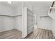 Walk-in closet with shelving, wood-look floors, and clothing rods at 253 White Willow Ave, Las Vegas, NV 89123