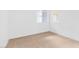 Empty bedroom featuring neutral carpeting and double windows at 2615 W Gary Ave # 1041, Las Vegas, NV 89123