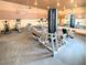 On-site gym with various cardio and weight training machines with neutral tones and large mirrors at 2615 W Gary Ave # 1041, Las Vegas, NV 89123