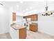 Kitchen with white appliances, granite counters, and breakfast bar at 2615 W Gary Ave # 1041, Las Vegas, NV 89123