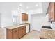 Bright kitchen features granite countertops and wood cabinetry at 2615 W Gary Ave # 1041, Las Vegas, NV 89123