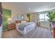 Serene bedroom featuring a queen-sized bed, stylish decor, and a peaceful atmosphere at 2633 Begonia Falls Ave # 88, North Las Vegas, NV 89081
