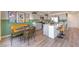Stylish open-concept kitchen with dining area, stainless appliances, modern decor, and ample counter space at 2633 Begonia Falls Ave # 88, North Las Vegas, NV 89081