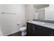 Bathroom with granite countertops, sleek dark vanity, chrome faucet, and modern fixtures at 2691 Mango Light Ave, North Las Vegas, NV 89086