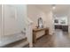 Bright entryway featuring wood-look flooring, a stairway and access to the kitchen at 2691 Mango Light Ave, North Las Vegas, NV 89086