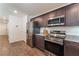 Modern kitchen featuring stainless steel appliances, granite countertops, and ample cabinet space at 2691 Mango Light Ave, North Las Vegas, NV 89086