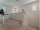 Upstairs loft area featuring neutral carpet and bright natural light at 2691 Mango Light Ave, North Las Vegas, NV 89086