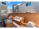 Backyard patio with wicker furniture, brick pavers, and privacy walls perfect for entertaining at 2691 Mango Light Ave, North Las Vegas, NV 89086