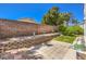 The backyard features a block wall and tiered landscaping, perfect for gardening at 2753 Port Of Call Dr, Las Vegas, NV 89128
