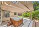 Backyard patio featuring a hot tub, with steps leading to the access door at 2753 Port Of Call Dr, Las Vegas, NV 89128