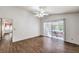 Bedroom with ceiling fan, tile floors, and a sliding glass door to the backyard at 2753 Port Of Call Dr, Las Vegas, NV 89128