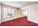 Bedroom with mirrored closet doors, and window at 2753 Port Of Call Dr, Las Vegas, NV 89128