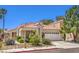 Well-maintained single-story home with a tile roof and desert landscaping at 2753 Port Of Call Dr, Las Vegas, NV 89128