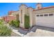 Well-maintained single-story home with desert landscaping and a two-car garage at 2753 Port Of Call Dr, Las Vegas, NV 89128