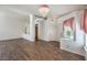 Open living room featuring wood-look tile floors and lots of natural light at 2753 Port Of Call Dr, Las Vegas, NV 89128