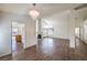 Spacious living room with a glimpse of the kitchen and a cozy fireplace at 2753 Port Of Call Dr, Las Vegas, NV 89128
