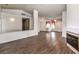 Open concept living room with fireplace, tile floors, and natural light at 2753 Port Of Call Dr, Las Vegas, NV 89128