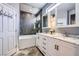 Bathroom featuring double vanity with marble countertop and modern fixtures, along with a shower and bathtub at 2810 Somerset Springs Dr, Henderson, NV 89052