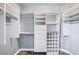 A closet with custom shelving and storage solutions including drawers, shelves, and hanging racks at 2810 Somerset Springs Dr, Henderson, NV 89052