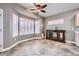 Elegant dining area featuring bay window with plantation shutters and stylish display cabinet at 2810 Somerset Springs Dr, Henderson, NV 89052