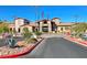 Attractive building exterior with a desert landscape, American flags, and ample parking at 2810 Somerset Springs Dr, Henderson, NV 89052