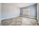 A light-filled room with tile floors, a modern chandelier, and plantation shutters for natural light at 2810 Somerset Springs Dr, Henderson, NV 89052