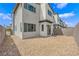 Low-maintenance backyard with gravel, partial brick patio, and a block wall providing a tidy outdoor area at 3192 Timorasso Ave, Henderson, NV 89044