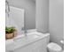 Modern bathroom with white vanity, quartz countertop, and sleek fixtures at 3192 Timorasso Ave, Henderson, NV 89044
