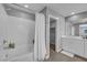 Clean bathroom with a white shower curtain, white cabinets, and tile floor at 3192 Timorasso Ave, Henderson, NV 89044