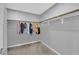 Spacious closet featuring ample storage with hanging rods and carpeted floor at 3192 Timorasso Ave, Henderson, NV 89044