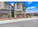 Exterior of home showcasing a two-car garage and landscaped front yard at 3192 Timorasso Ave, Henderson, NV 89044