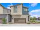 Charming two-story home featuring a two-car garage and modern architectural details at 3192 Timorasso Ave, Henderson, NV 89044