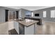 Island view featuring a modern kitchen, and adjacent living area at 3192 Timorasso Ave, Henderson, NV 89044
