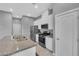 Modern kitchen with white cabinets, granite counters, and stainless appliances at 3192 Timorasso Ave, Henderson, NV 89044