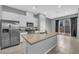 Modern kitchen features stainless steel appliances and granite countertops at 3192 Timorasso Ave, Henderson, NV 89044