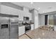 Well-equipped kitchen featuring stainless steel appliances and granite countertops at 3192 Timorasso Ave, Henderson, NV 89044