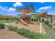 Community playground featuring a slide and shade structure providing a fun and shaded recreation area for families at 3192 Timorasso Ave, Henderson, NV 89044