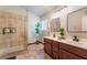 Bathroom with a glass-enclosed shower, double vanity with sinks, and contemporary decor at 3443 Citruscedar Way, North Las Vegas, NV 89032