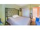 Bedroom with a comfortable bed, closet, furnishings, and view into bath at 3443 Citruscedar Way, North Las Vegas, NV 89032