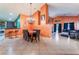 View of dining room featuring a chandelier, bar seating, and tile floors at 3443 Citruscedar Way, North Las Vegas, NV 89032