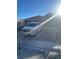 Exterior front view of the house with white truck and a wrought iron fence at 3443 Citruscedar Way, North Las Vegas, NV 89032
