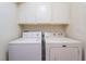 Practical laundry room with a side-by-side washer and dryer at 3443 Citruscedar Way, North Las Vegas, NV 89032