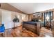 Spacious main bedroom with hardwood floors, a large bed, and a stylish decor at 3443 Citruscedar Way, North Las Vegas, NV 89032