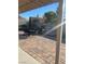View of patio with brick pavers, patio furniture, built-in grill, and artificial grass at 3443 Citruscedar Way, North Las Vegas, NV 89032
