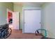 Carpeted room featuring closet and doorway leading to another room at 3443 Citruscedar Way, North Las Vegas, NV 89032