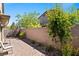 Charming backyard featuring a brick-paved patio and lush greenery for a serene setting at 3709 Neblina Dr, Henderson, NV 89052