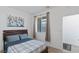 Bedroom with a wood-framed bed, and natural light from a window at 3709 Neblina Dr, Henderson, NV 89052