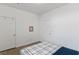 Bright bedroom with two doors, wooden floors, and neutral walls at 3709 Neblina Dr, Henderson, NV 89052