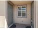 Exterior view of townhome entrances, with neutral paint and brick pathway at 3709 Neblina Dr, Henderson, NV 89052
