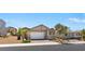 Inviting single-story home with a brick driveway, neutral paint scheme, a two-car garage, and desert landscaping at 3709 Neblina Dr, Henderson, NV 89052